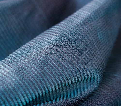 close-up view of woven fabric in shades of blue showcasing texture and pattern perfect for three-dimensional designs